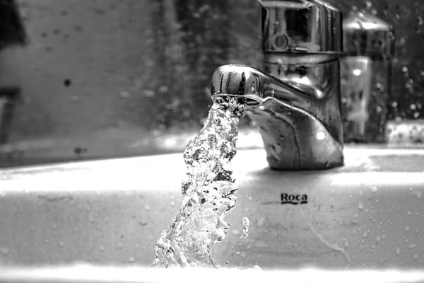image of tap with splashing water