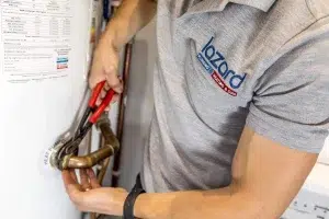 lazard plumber working on a boiler
