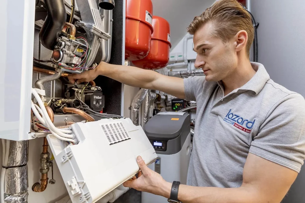 lazard plumber working on central heating system